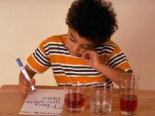 young boy concentrating on his homework