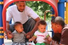 Directional Awareness two children and their parents using directional awareness as they use slide at the playground