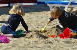 children playing in the sand, practicing associative play